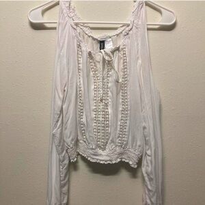 White open shoulder blouse with lace detailing. Fits like small. Crop top